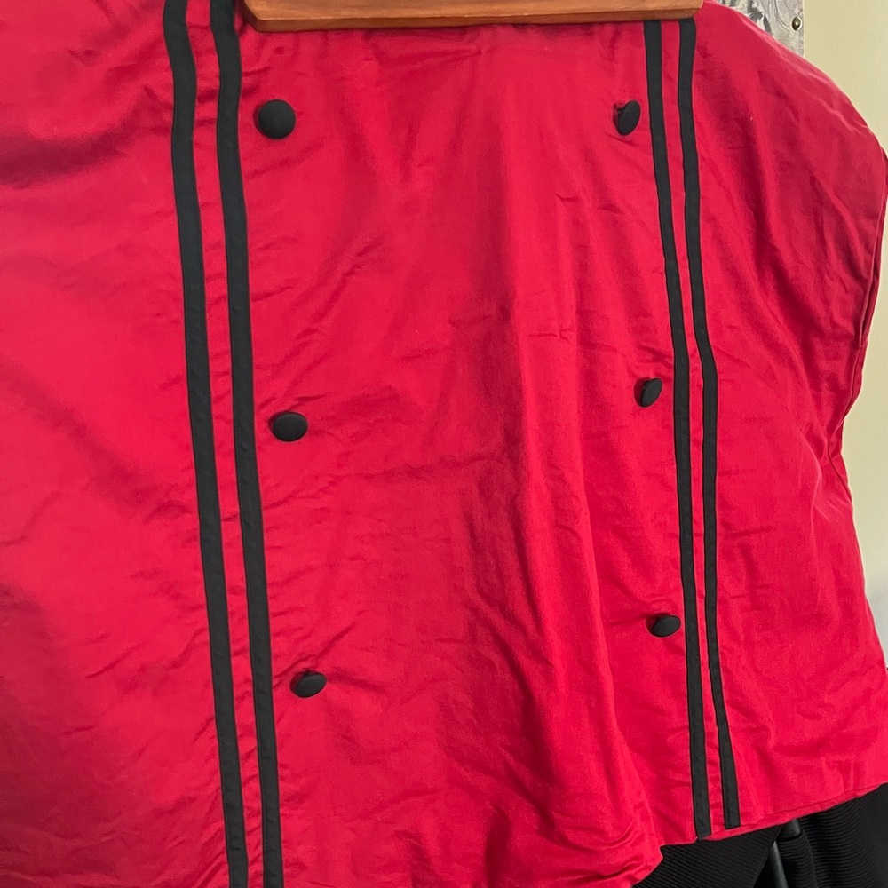 Red skirt with black buttons and black trim down front